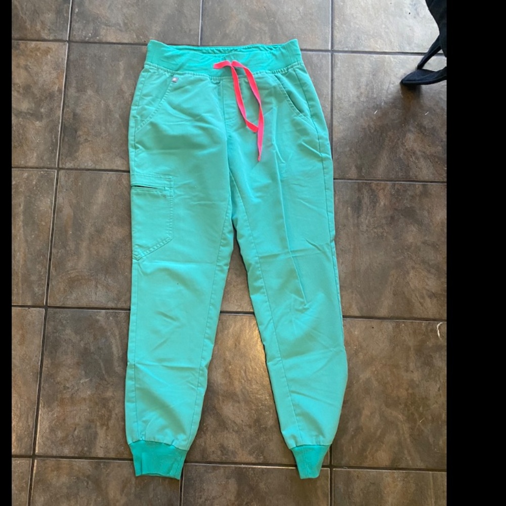 Medical green scrubs with hot pink tie